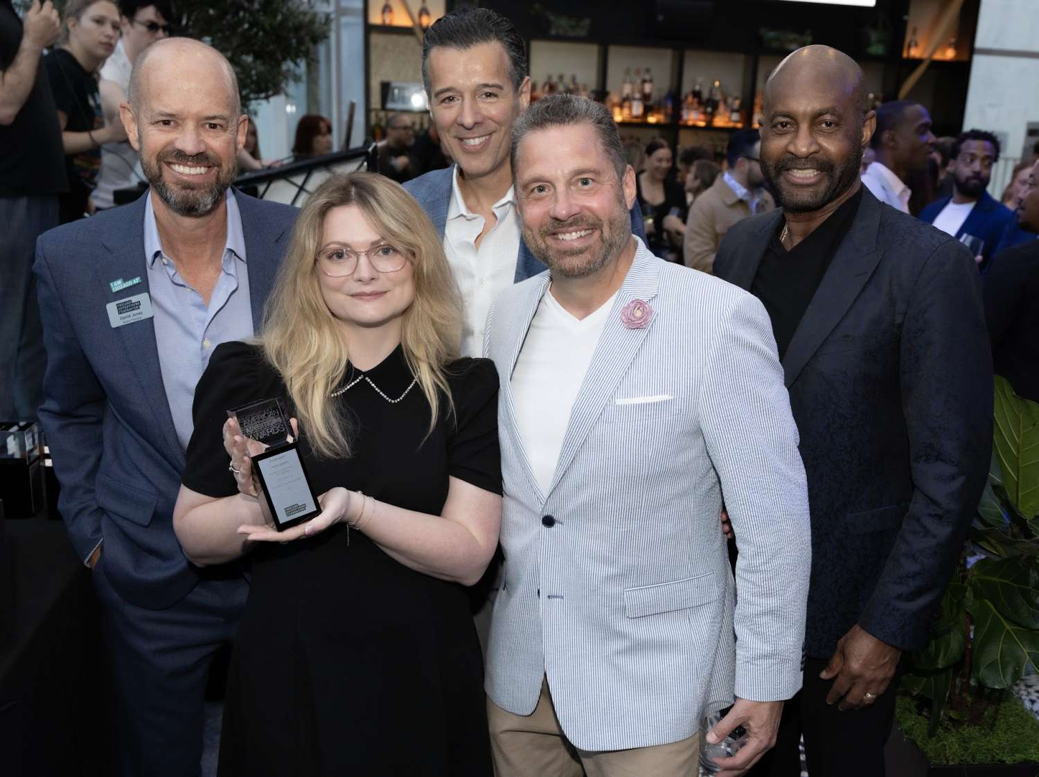 advertising agency holding trophy for Chicago Addy win
